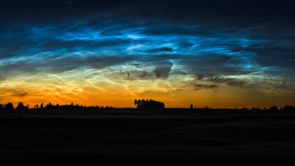 Noctilucent clouds in Lithuania (© ljphoto7/Getty Images)