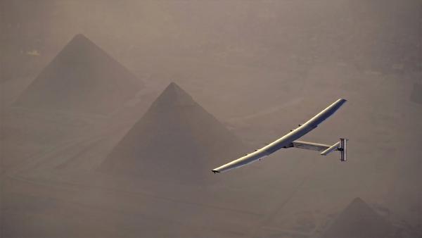 Solar Impulse 2 flying over the pyramids in Giza, Egypt (© Jean Revillard/Solar