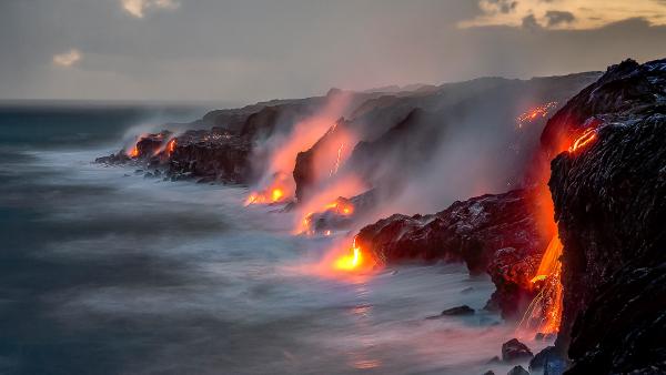 A series of lava flows spill into the ocean, Big Island, Hawaii (© Ken McCurdy/Getty Images)