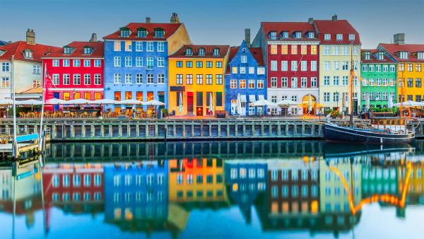 Colorful homes line Nyhavn Canal, Copenhagen, Denmark (© emicristea/Getty Images)