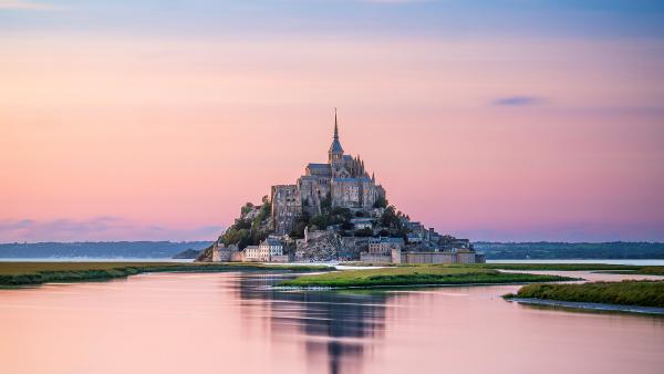 Mont-Saint-Michel during high tide, Manche, Normandy, France (© Clement LEONARD/Getty Images)