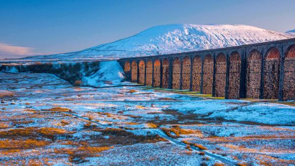 Ribblehead Viaduct and Ingleborough mountain, North Yorkshire, England (© AWL Images/DanitaDelimont.com)