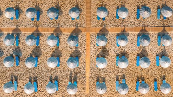 Sunbeds on the beach at Vai, Crete, Greece (© borchee/Getty Images)